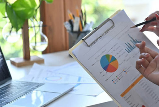 People reviewing printed financial data