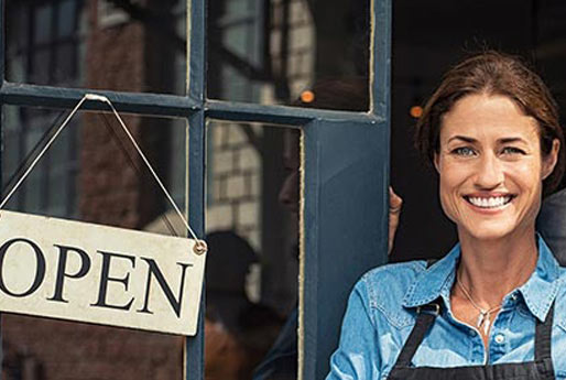 Woman at the doorway of her small business