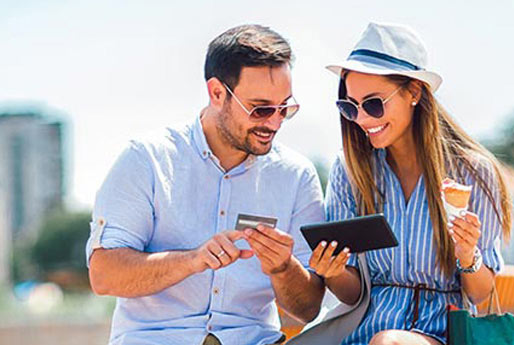 Happy couple using their smartphone